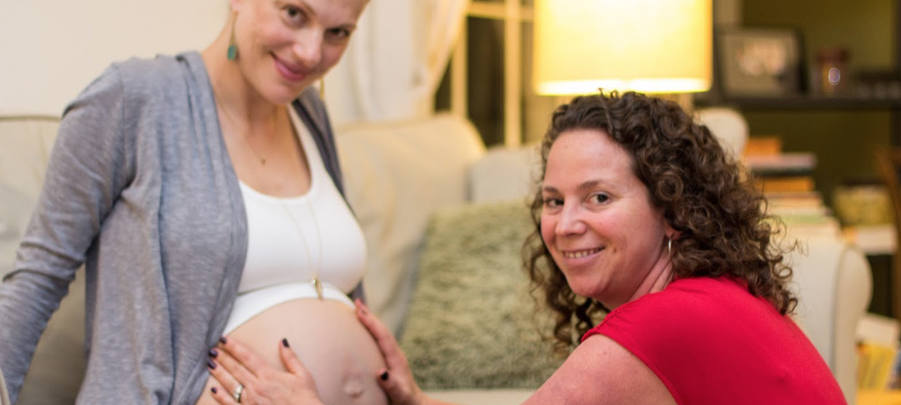 Doula Helping Pregnant Woman