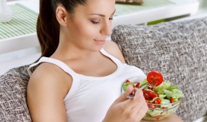 Pregnant women eating a salad