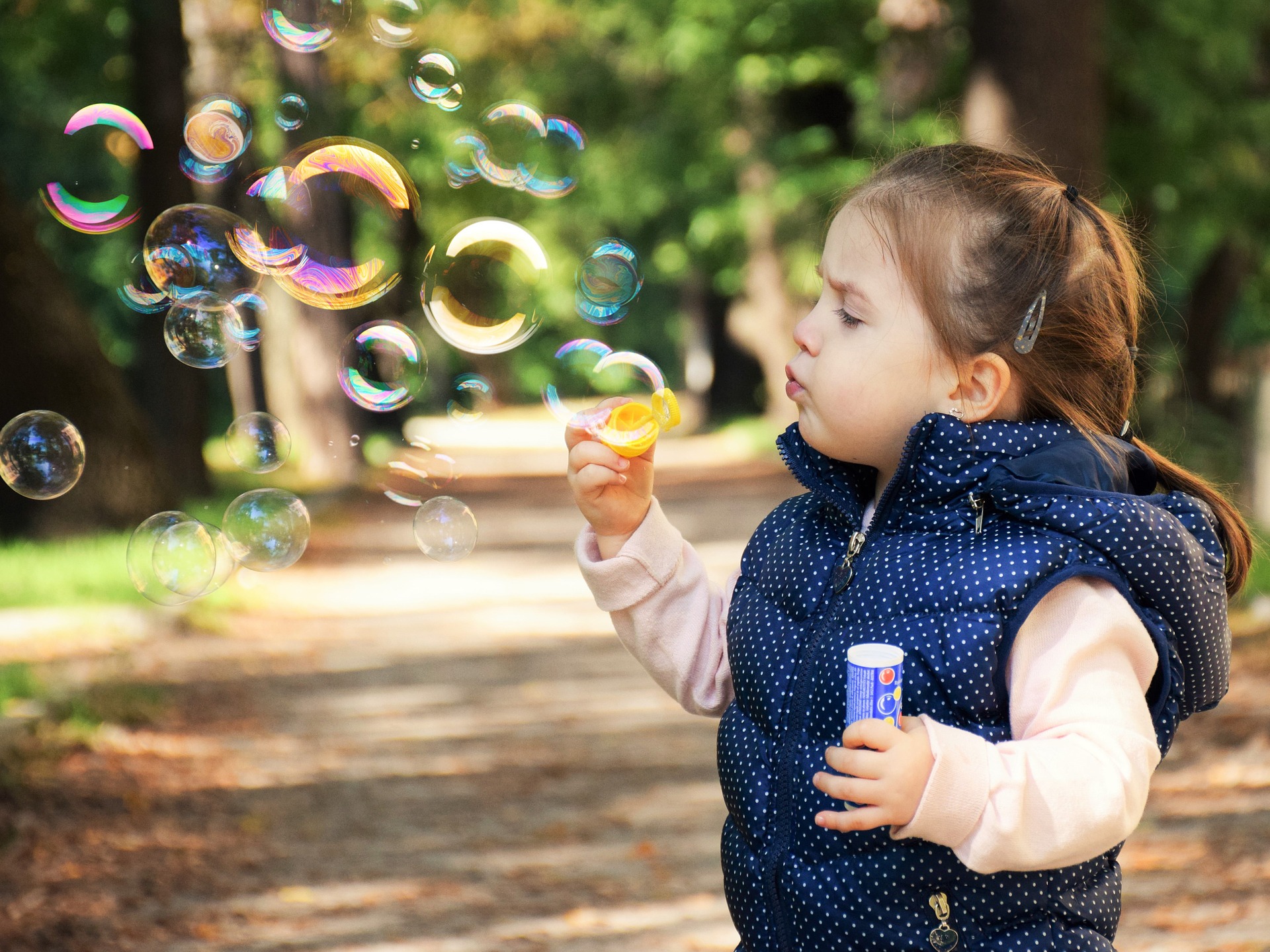 kid blowing bubbles