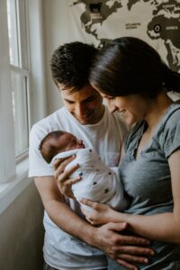 parents holding a newborn