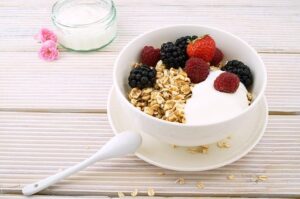 yogurt and fruit in a white bowl