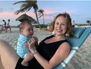 Mother and baby on beach 