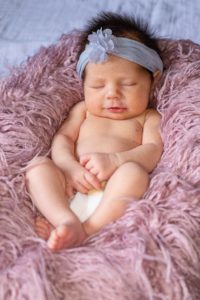 Baby on pink blanket