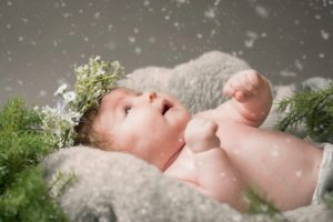 baby with snow flakes 