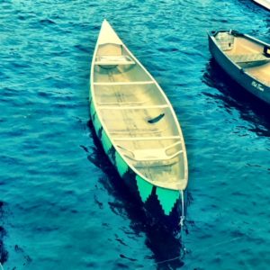 Empty canoe in water