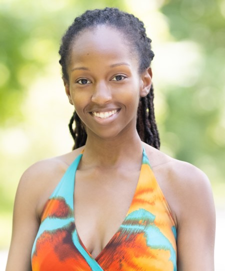 Dark skinned woman with floral halter top