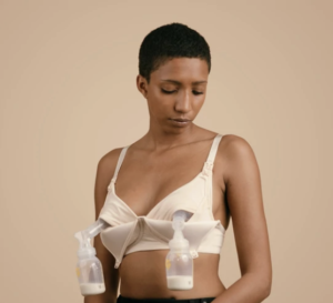 Africain american woman with short hair using a pumping bra