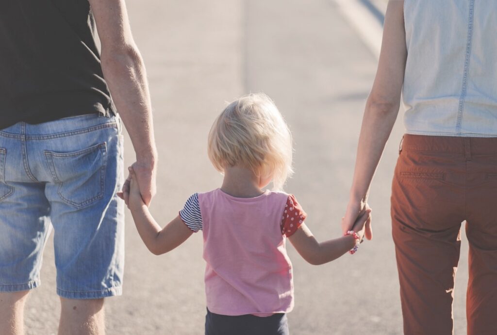 Parents walking with toddler 