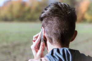 back of a person's head while on the phone